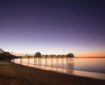 View of Scarness Pier at sunset