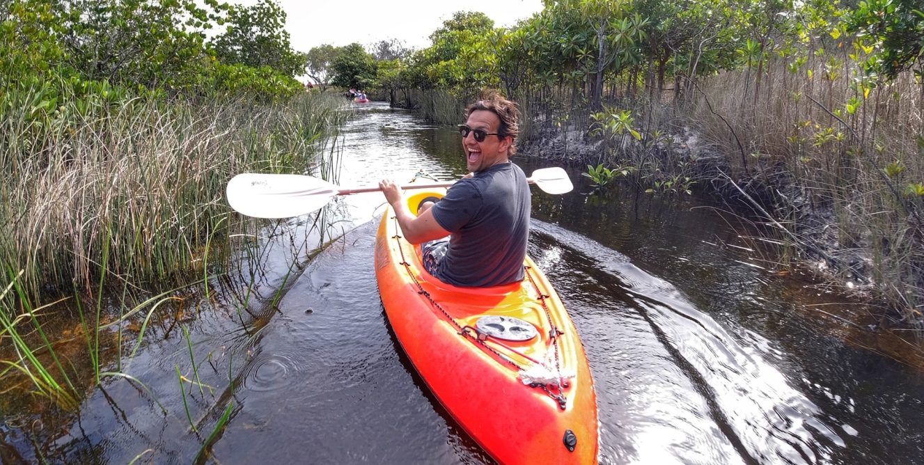 Man kayaking down Awinya Creek