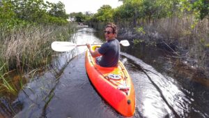 Man kayaking down Awinya Creek