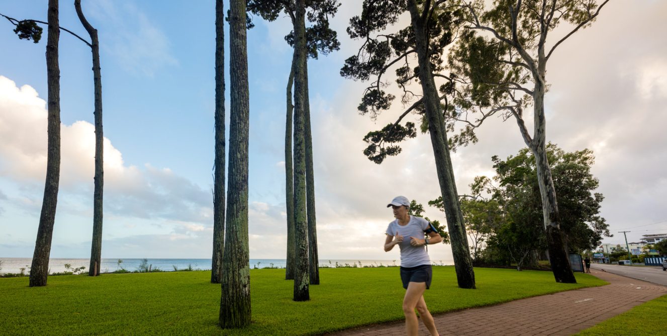 Woman running along path at Torquat Beach