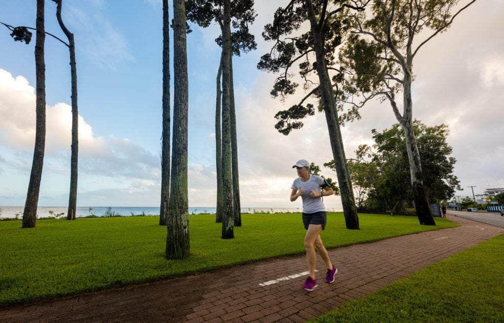 Woman running along path at Torquat Beach